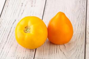 Ripe yellow bright juicy tomato photo