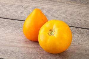 Ripe yellow bright juicy tomato photo