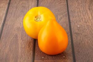 Ripe yellow bright juicy tomato photo