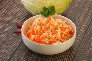 Sauerkraut - pickled cabbage in the bowl photo