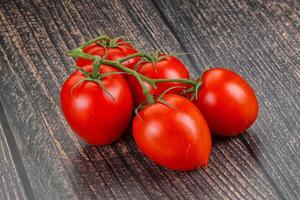 Raw red Flamenco tomato branch photo