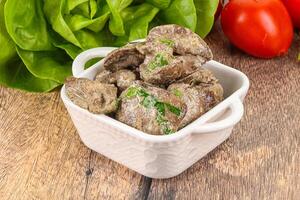 Chicken liver with cream sauce photo