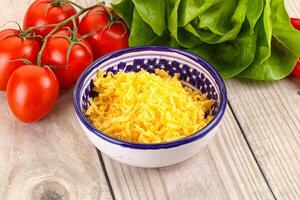 Shredded cheese in the bowl photo