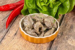 Chicken liver with cream sauce photo