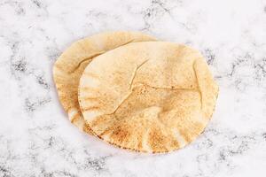 Traditional eastern round pita bread photo