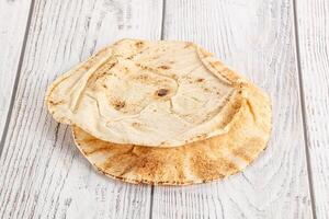 Traditional eastern round pita bread photo