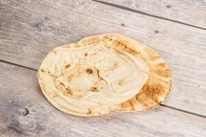 Traditional eastern round pita bread photo