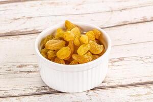 Yellow raisin - dry grape berries photo