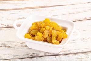 Yellow raisin - dry grape berries photo