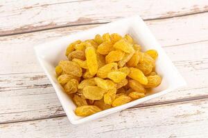 Yellow raisin - dry grape berries photo