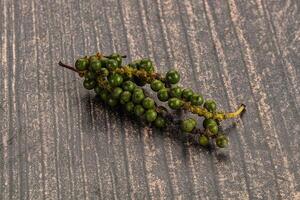 Green pepper corn heap isolated photo