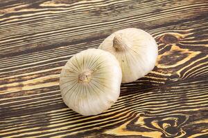 Raw white onion heap isolated photo