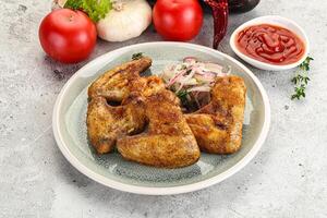 Grilled chicken wings with sauce photo