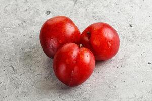 Ripe sweet juicy red plum photo