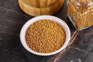 Mustard dry seeds in the bowl photo