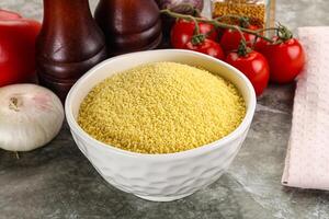 Raw dry wheat couscous grain photo