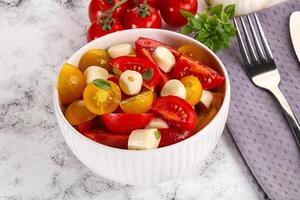 Italian Caprese salad with tomato and mozzarella photo