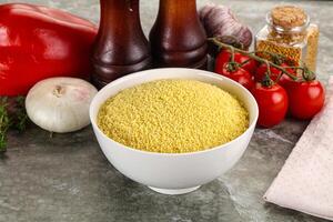 Raw dry wheat couscous grain photo