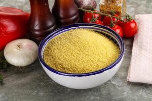 Raw dry wheat couscous grain photo