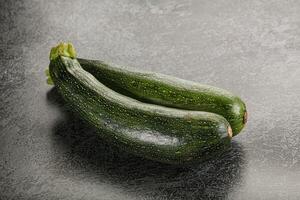 Raw young small green zucchini photo