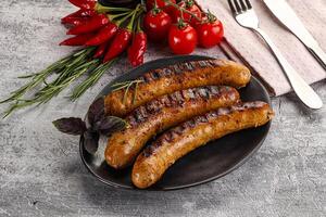 Grilled meat sausages with spices photo