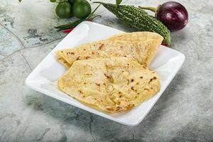 Indian tandori bread - naan with cheese photo