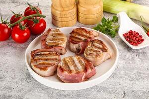 Grilled pork tenderloin with bacon photo