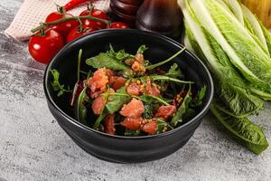 Salad with salmon and arugula photo