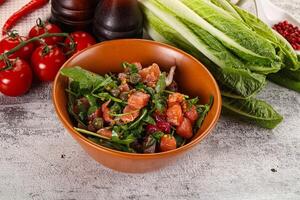 Salad with salmon and arugula photo