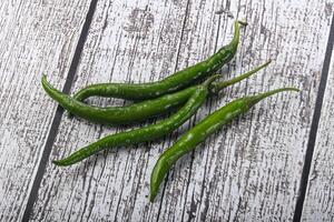 Hot and spicy green chili pepper photo