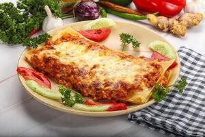 Italian lasagna with meat and tomato photo