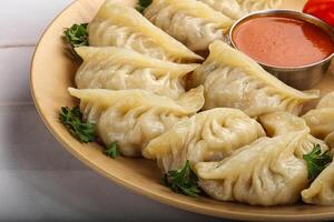 Tibetian dumplings Momo with chicken, meat or vegetables photo