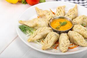 Steamed asian dumpling momo with meat photo