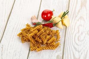 Raw whole grain pasta fusilli photo