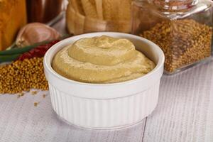 Dijon mustard sauce in the bowl photo