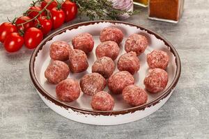 Uncooked raw beef meatball minced photo