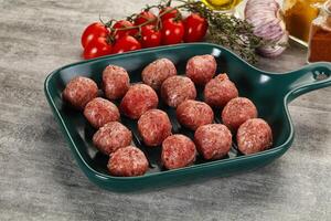 Uncooked raw beef meatball minced photo