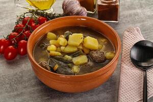 Soup with meatball and potato photo