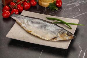 Whole raw salted herring fish photo