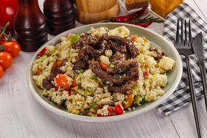 Traditional couscous with beef and vegetables photo