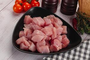 Diced raw turkey fillet cubes photo