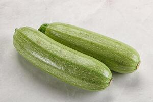 Raw green ripe zucchini vegetable photo