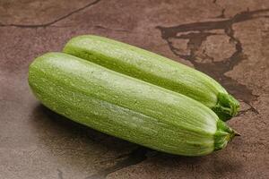 Raw green ripe zucchini vegetable photo