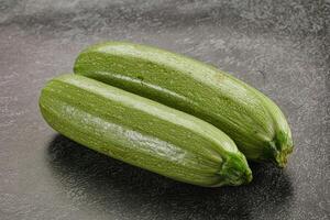 Raw green ripe zucchini vegetable photo