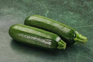 Raw green ripe zucchini vegetable photo