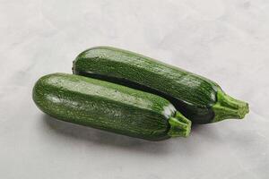 Raw green ripe zucchini vegetable photo