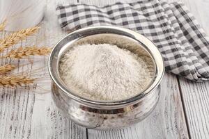 Wheat flour heap for bake photo