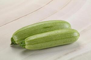 Raw green ripe zucchini vegetable photo