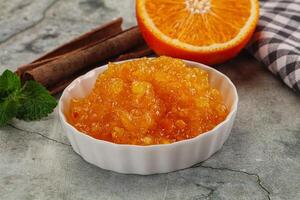 Tasty homemade Orange jam in the bowl photo