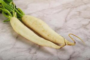 Raw ripe organic Daikon root photo